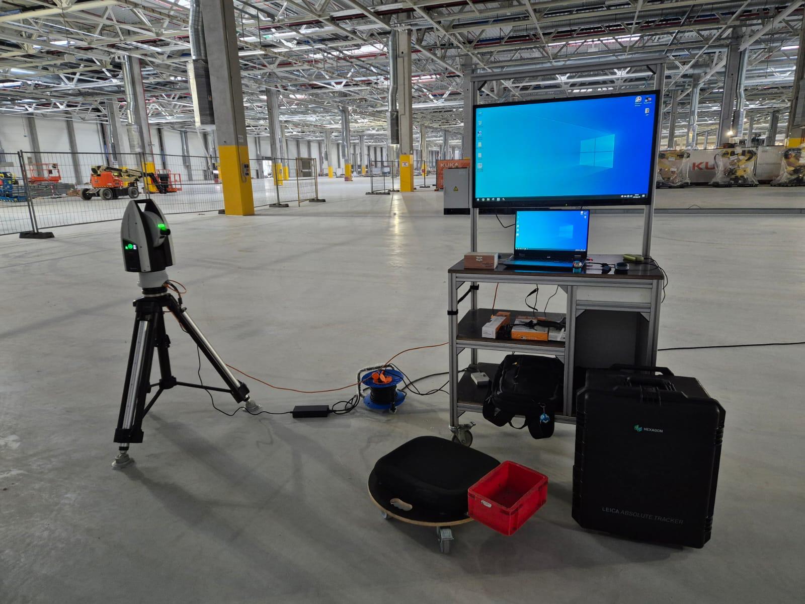 3D inspection station with scanner and workstation on large industrial floor