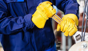 Technician performing manual maintenance task