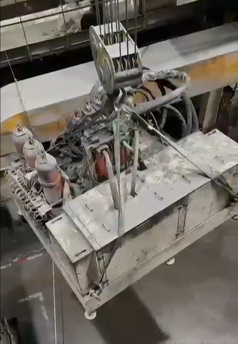 Lifted industrial unit during relocation operation