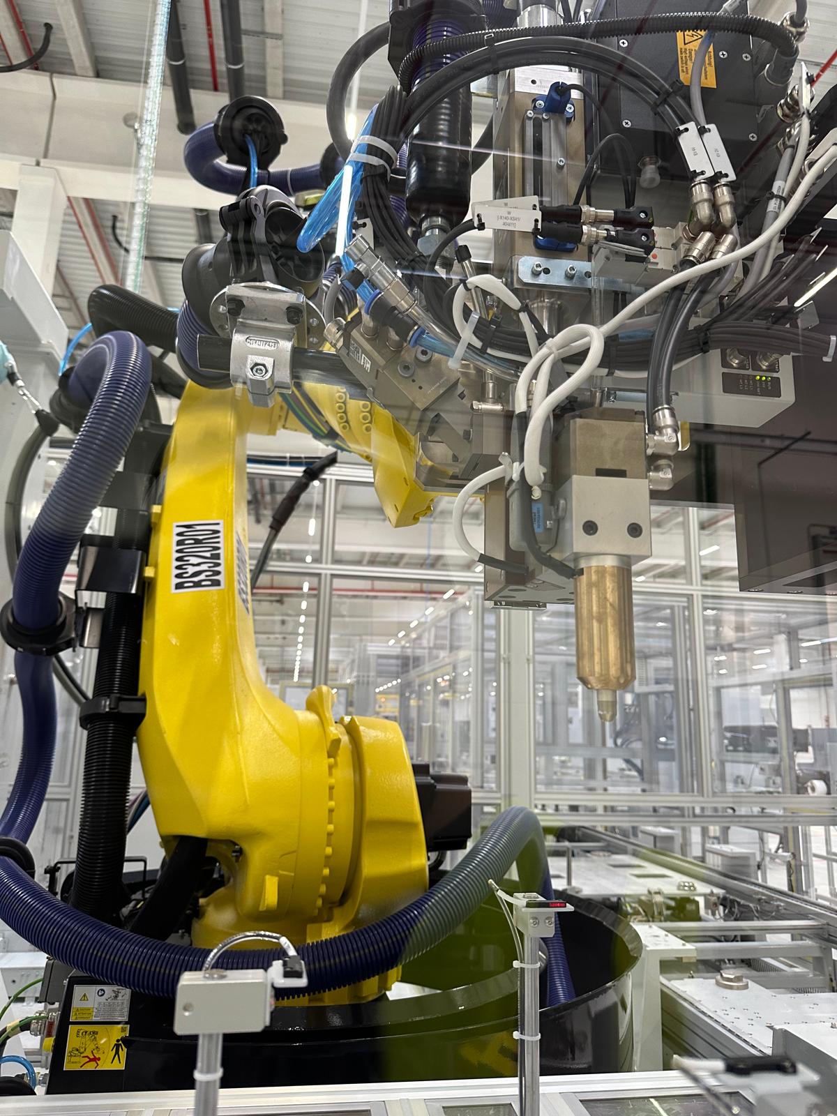 Industrial robot end-of-arm and tooling detail during programming work